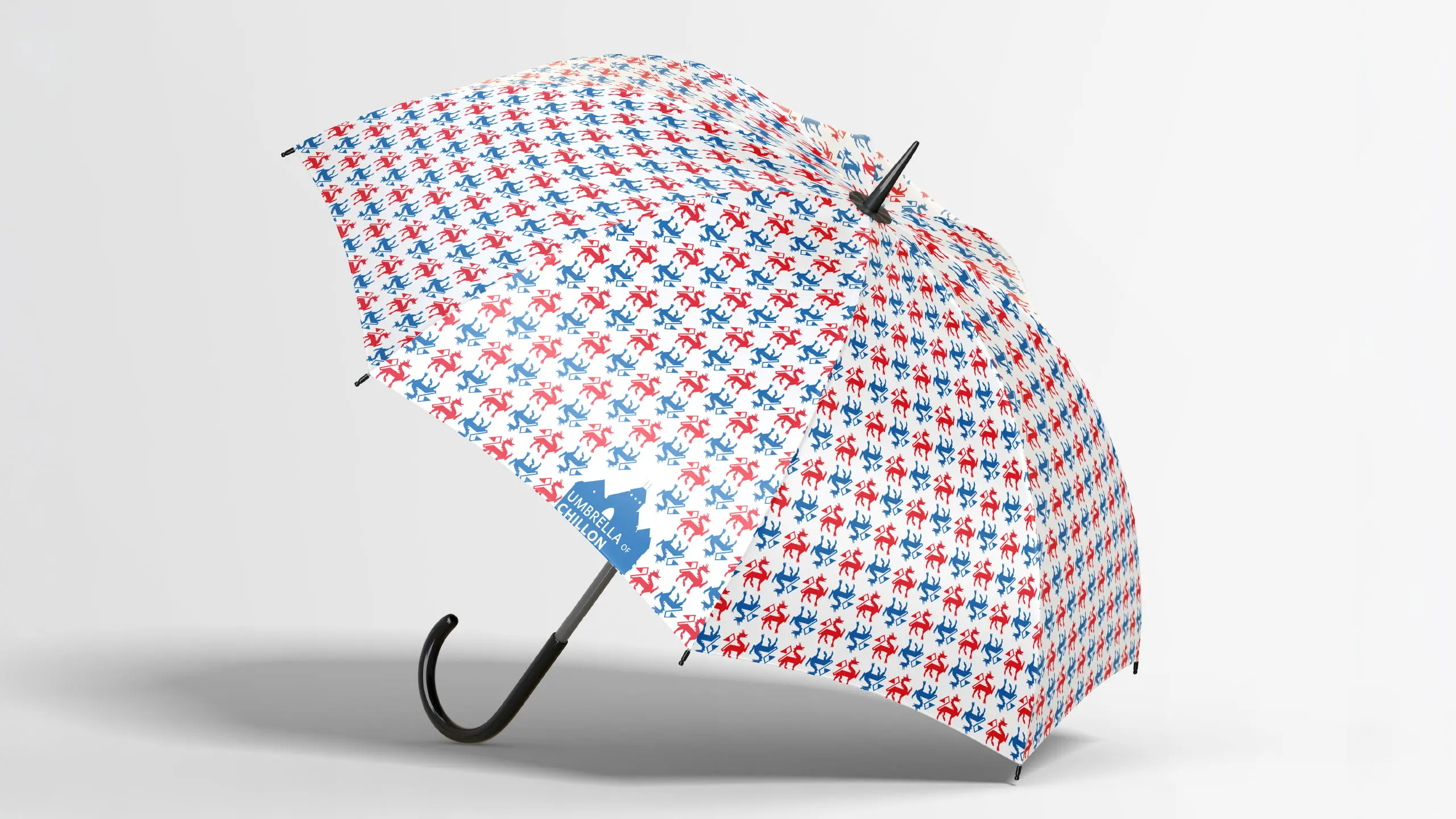 Parapluie « Umbrella of Chillon » à motif dragons rouge et bleu, ouvert, avec logo château