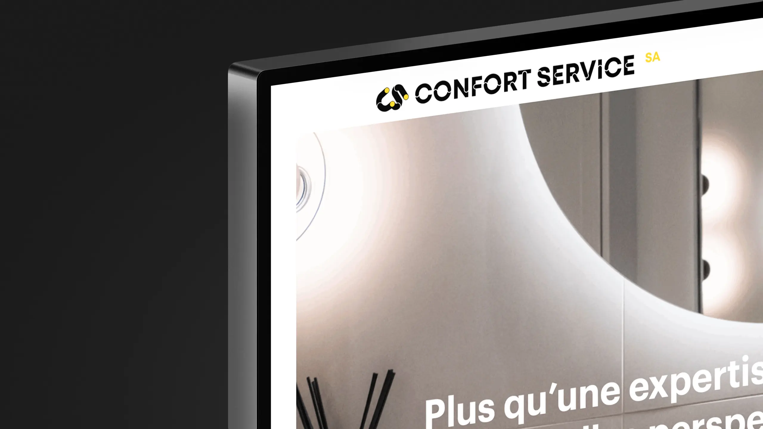 Détail du site Confort Service à l'écran, logo et signature en tête de page